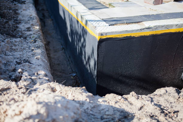 Professional Basement Waterproofing technician working in Delmont, NJ